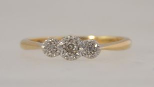 An 18ct gold and platinum diamond ring set with a central diamond with illusion platinum stones