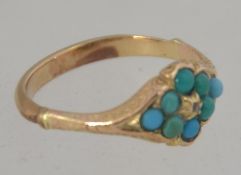 A Victorian 9ct gold, turquoise and diamond ring. The central 1pnt diamond with turquoise borders.
