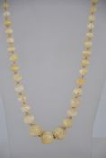 An early 20th century knotted bead necklace of graduating form dating to the Edwardian period.