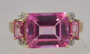 A 10ct gold, diamond and believed pink sapphire ladies dress ring.