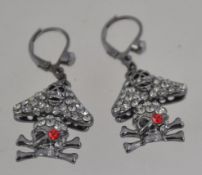 A pair of Butler & Wilson rhinestone set Pirate skull and crossbones clip on earrings.