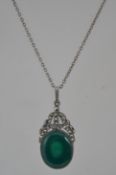 A vintage Art Deco style silver and green agate with marcasite pendant on chain. Marked 925.