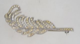 A 1950's silver and rhinestone brooch in the form of a palm leaf.