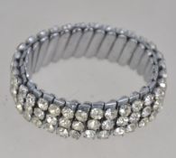 A vintage silver tone expanding bracelet cuff set with rhinestones