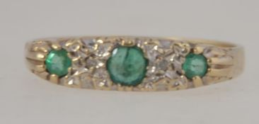 A 9ct gold emerald and diamond ring in a gypsy setting, the emeralds approx 30pnts. Total weight 2.