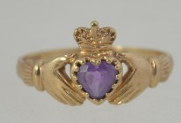 A 9ct gold hallmarked amethyst ladies ring having heart shaped amethyst under crown and within