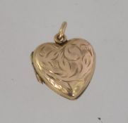 9ct gold front and back heart shape locked with chase decoration and round bale atop.