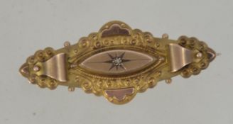 An Edwardian 9ct gold and diamond brooch. The central lozenge inset with diamond. Makers TH.