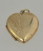 9ct gold front and back heart shape locked with chase decoration and round bale atop.