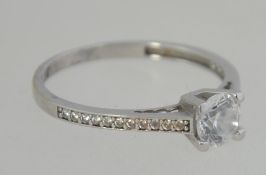 A 9ct white gold single stone ring.