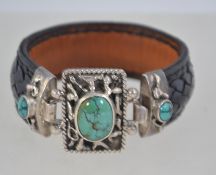 A heavy silver turquoise and leather cuff bracelet being unmarked but tests as sterling.