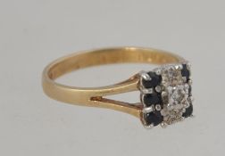 A 9ct gold, sapphire and diamond ring being pave set with 6 sapphires surrounded by 3 2pnt diamonds.