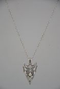 A silver 925 necklace chain and devils mask pendant. Stamped 925. Weight 8.