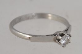 A ladies vintage platinum and diamond single stone ring.