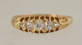 A Victorian 15ct gold five stone diamond ring ring set with approx 20pts of diamonds with scroll