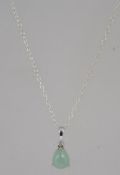 A contemporary silver necklace and green moonstone pendant.