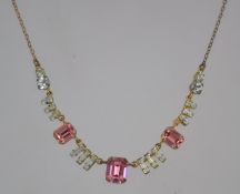 A 1930's Art Deco gold tone rhinestone set necklace strung with baguette,