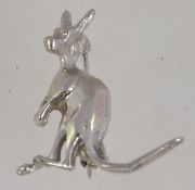 A vintage white metal figural brooch pin in the form of a kangaroo with roller clasp. Measures 3.