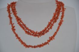 A vintage silver and coral 3 strand choker necklace.
