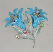 A vintage 1950's silver tone and enamel figural brooch pin of a spray of flowers set with Aurora