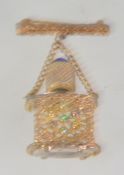 A 1960's / 1970's glass miniature perfume bottle fob brooch being set with rhinestones - gold tone