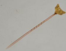 A 15ct gold stick / hat pin with fox head mount.