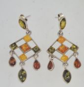 A silver and amber chandelier earrings set of 4 colours of amber being marked 925.