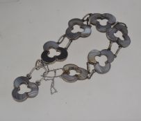 An unusual vintage silver and agate bracelet with pieced agate set trefoil links with trefoil lock