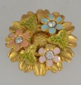 A 1950's gold plated sunflower brooch pin set with enamelled ivy and flowers embelished with