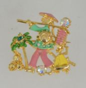 A vintage 1950's gold tone and enamel figural brooch pin of a oriental person set with Aurora