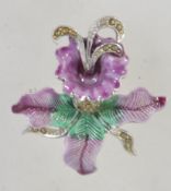 A 1950's enamel and marcasite brooch in the form of an orchid. Silver tone with rollover catch. 4.