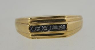 A 9ct gold and black diamond ring.
