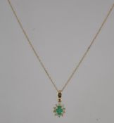A 9ct gold and emerald pendant and necklace chain.