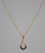 A hallmarked 9ct gold Figaro chain pendant necklace,