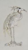 A large vintage bird brooch with rhinestones set in a silver tone settting with roll over catch