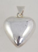 A heavy silver puffed heart chime pendant being marked 925.