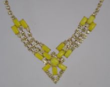 A 1950's rhinestone festoon prom necklace set with yellow rhinestones and glass beads with hook