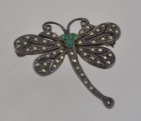 A silver and marcasite brooch in the form of a dragonfly. Pin verso.