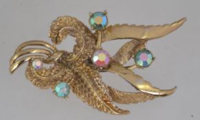 A large vintage Hollywood brooch set with AB rhinestones with roller clasp. Signed Hollywood.