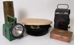 MILITARIA: A collection of assorted military and similar items to include an admiralty peaked cap,