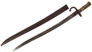 BAYONET; An antique French brass bayonet, with brass hilt and original scabbard. 70cm long approx.