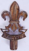 BRASS EMBLEM: A brass cane topper / emblem / standard knop in the form of the Fluer De Lys,