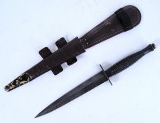 COMMANDO DAGGER: A Fairburn & Sykes commando / fighting knife / dagger. With scabbard. 30cm long.