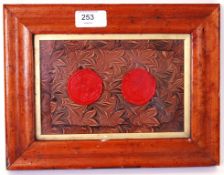 WAX SEALS: An unusual and rare framed pair of antique wax seals.
