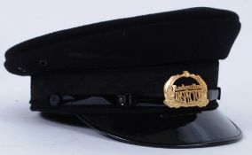 BUS UNIFORM: A 20th century Badgerline Bus Inspectors peaked cap with gilt metal cap badge to front.