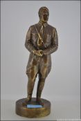 ADOLPH HITLER: A 20th century bronze figure of Adolf Hitler, in typical pose. Measures: 28cms high.