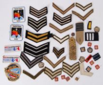 PATCHES: A LARGE collection of assorted military / uniform / civilian shoulder titles, arm patches,
