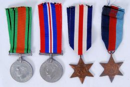 WWII MEDAL GROUP: A Second World War medal group comprising of War Medal, Defense Medal,