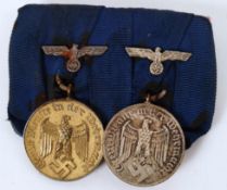 THIRD REICH MEDALS: A pair of original WWII Second World War issued 4 & 12 year Army / Navy service