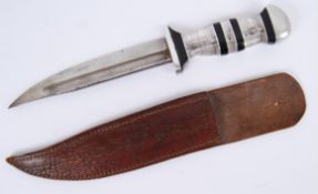 DAGGER: An unusual likely WWII Second World War period dagger with white metal and blackened handle.